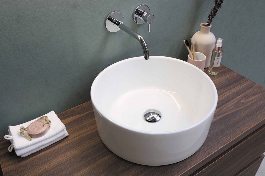 A modern bathroom vessel sink with a chrome wall-mounted faucet
